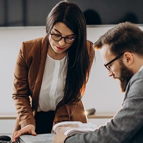A woman and a man going trough documents