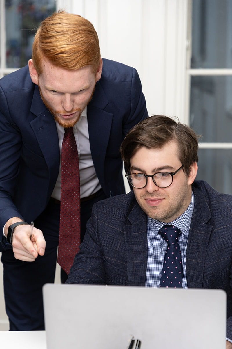 Our tax advisors, Killian and Scott, discussing a tax strategy